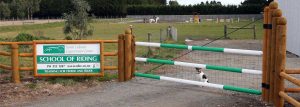 A gate made from jump rails turned by The Pole Man.